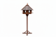 Rustikales Vogelhaus mit Ständer